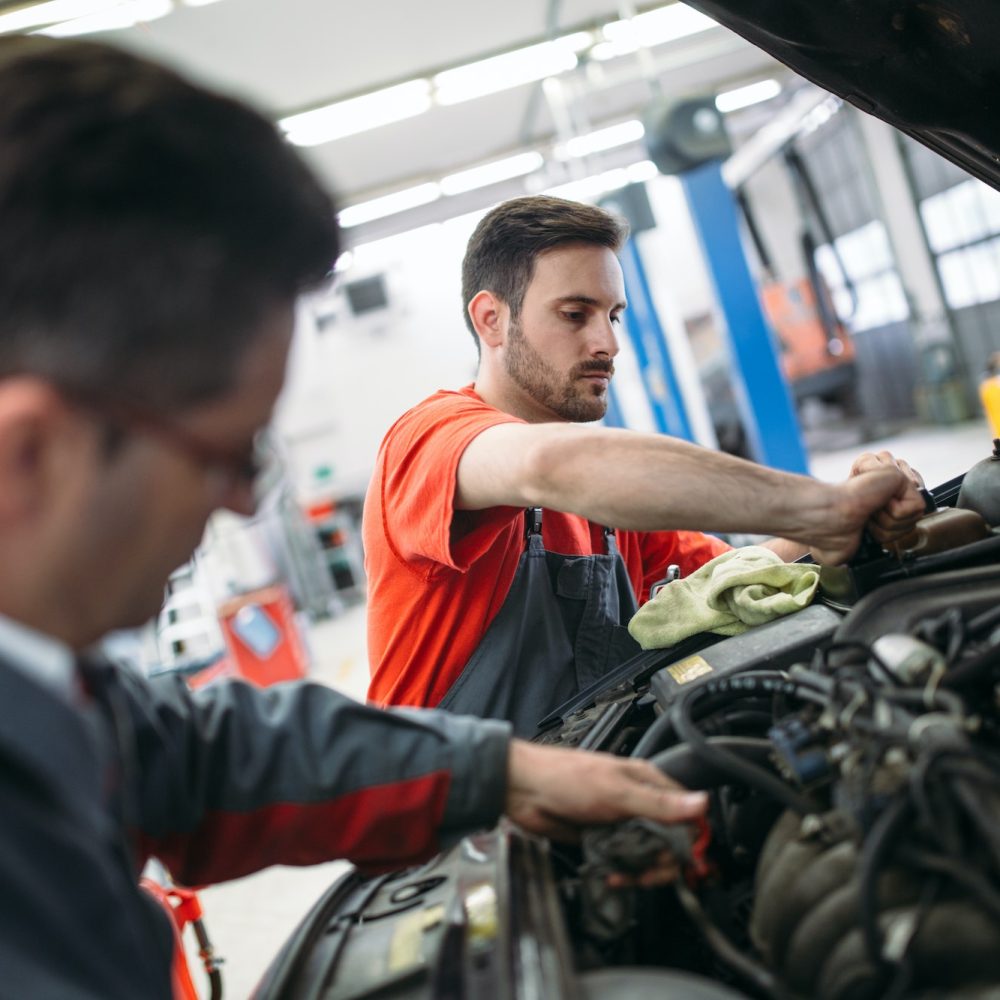 profecional-car-mechanic-changing-motor-oil-at-maintenance-repair-service-station.jpg